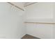 Large closet with double hanging rods and shelving at 17840 W Calavar Rd, Surprise, AZ 85388