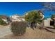 House exterior showcasing landscaping and neighborhood view at 17840 W Calavar Rd, Surprise, AZ 85388