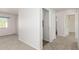 Bright hallway with access to laundry and bathroom at 17840 W Calavar Rd, Surprise, AZ 85388