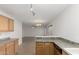 Bright kitchen features light wood cabinets and granite countertops at 17840 W Calavar Rd, Surprise, AZ 85388