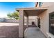 Covered patio with concrete flooring and a view of the backyard at 17840 W Calavar Rd, Surprise, AZ 85388