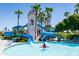 Community pool with water slides and lighthouse play structure at 17855 W Thistle Landing Dr, Goodyear, AZ 85338