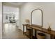 Bright entryway with wood console table and large mirror at 17855 W Thistle Landing Dr, Goodyear, AZ 85338