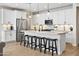 Modern kitchen with white cabinets and granite countertops at 17855 W Thistle Landing Dr, Goodyear, AZ 85338