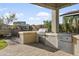 Outdoor kitchen with grill and ample counter space at 17855 W Thistle Landing Dr, Goodyear, AZ 85338