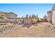 Landscaped backyard with a rock pathway, and a gate at 18672 W Santa Irene Dr, Goodyear, AZ 85338