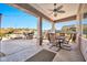 Covered patio with outdoor seating and grill at 18672 W Santa Irene Dr, Goodyear, AZ 85338