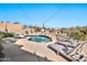 Stunning pool and spa area with lounge chairs and a basketball hoop at 18672 W Santa Irene Dr, Goodyear, AZ 85338