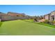 Artificial turf putting green with a view of the surrounding landscape at 18672 W Santa Irene Dr, Goodyear, AZ 85338