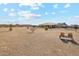 Spacious backyard features a gravel area and a couple of chairs at 216 W Paoli St, San Tan Valley, AZ 85143