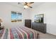 Bedroom with dresser, TV, and window offering scenic views at 216 W Paoli St, San Tan Valley, AZ 85143