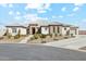 Single-story home with attractive landscaping and a long driveway at 216 W Paoli St, San Tan Valley, AZ 85143