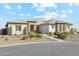 Single story home with desert landscaping and a three-car garage at 216 W Paoli St, San Tan Valley, AZ 85143