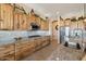 Spacious kitchen with granite countertops and rustic wood cabinets at 216 W Paoli St, San Tan Valley, AZ 85143