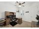 Home office with wood desk, chair, and built-in shelves at 216 W Paoli St, San Tan Valley, AZ 85143