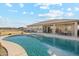 Inviting backyard pool with ample patio space for entertaining at 216 W Paoli St, San Tan Valley, AZ 85143