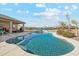 Large freeform pool with a spacious backyard at 216 W Paoli St, San Tan Valley, AZ 85143