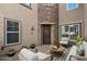 Charming courtyard with stone accents, seating area, and well-lit entrance, creating an inviting outdoor space at 21809 N 39Th St, Phoenix, AZ 85050