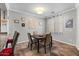 Bright dining area with a wooden table and four chairs at 21809 N 39Th St, Phoenix, AZ 85050