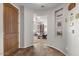 Entryway with wood door and view into living room at 21809 N 39Th St, Phoenix, AZ 85050