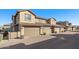 Townhouse exterior with three-car garage and gated entry at 21809 N 39Th St, Phoenix, AZ 85050