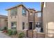 Tan two-story home with stone accents and a private patio at 21809 N 39Th St, Phoenix, AZ 85050