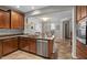 Kitchen with island, stainless steel appliances, and wood cabinets at 21809 N 39Th St, Phoenix, AZ 85050