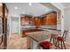 L-shaped kitchen with wood cabinets and granite countertops at 21809 N 39Th St, Phoenix, AZ 85050