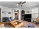 Spacious living room with seating, a TV, and a view of the kitchen at 21809 N 39Th St, Phoenix, AZ 85050