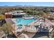 Community pool area with multiple seating and shade options at 21809 N 39Th St, Phoenix, AZ 85050