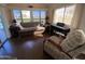 Bright living room with sofa, armchair, and piano at 2273 S Seminole Dr, Apache Junction, AZ 85119