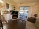 Living area with electric fireplace and kitchen view at 2273 S Seminole Dr, Apache Junction, AZ 85119