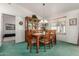 Bright dining area with a wooden table, chairs, and a built-in hutch at 2329 N Recker Rd # 94, Mesa, AZ 85215