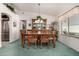 Dining room with wooden table and chairs, and a china cabinet at 2329 N Recker Rd # 94, Mesa, AZ 85215