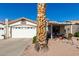 House exterior featuring a two-car garage, covered patio, and desert landscaping at 2329 N Recker Rd # 94, Mesa, AZ 85215