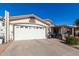 Exterior view showcasing the garage and a partially visible covered patio at 2329 N Recker Rd # 94, Mesa, AZ 85215