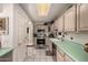 Clean and spacious kitchen featuring stainless steel appliances and light wood cabinets at 2329 N Recker Rd # 94, Mesa, AZ 85215