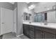 Double vanity bathroom with modern finishes and a soaking tub at 2405 E Beverly Rd, Phoenix, AZ 85042