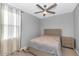 Cozy bedroom with a full-size bed and ceiling fan at 2405 E Beverly Rd, Phoenix, AZ 85042