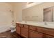 Bathroom with double vanity and shower/tub combo at 244 W Wier Ave, Phoenix, AZ 85041