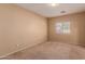 Bright bedroom with neutral walls and carpet at 244 W Wier Ave, Phoenix, AZ 85041