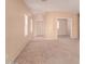 Bright and airy living room with neutral carpeting and an open floor plan at 244 W Wier Ave, Phoenix, AZ 85041