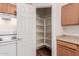 Walk-in pantry with ample shelving for storage at 244 W Wier Ave, Phoenix, AZ 85041