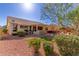 Landscaped backyard with patio and outdoor kitchen at 24826 S Stoney Lake Dr, Sun Lakes, AZ 85248