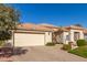 Attractive single-story home with light-colored exterior and a landscaped front yard at 24826 S Stoney Lake Dr, Sun Lakes, AZ 85248