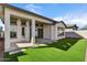 Covered patio, grassy area, and tile patio at 26123 N 20Th Dr, Phoenix, AZ 85085