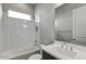 Clean bathroom with white tile and a bathtub at 26123 N 20Th Dr, Phoenix, AZ 85085