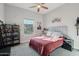 Bright bedroom with a comfortable bed and built-in shelving at 26123 N 20Th Dr, Phoenix, AZ 85085