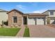 Single-story home with stone accents and a two-car garage at 26123 N 20Th Dr, Phoenix, AZ 85085