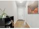 Bright foyer with wood-look flooring and shoe storage at 26123 N 20Th Dr, Phoenix, AZ 85085